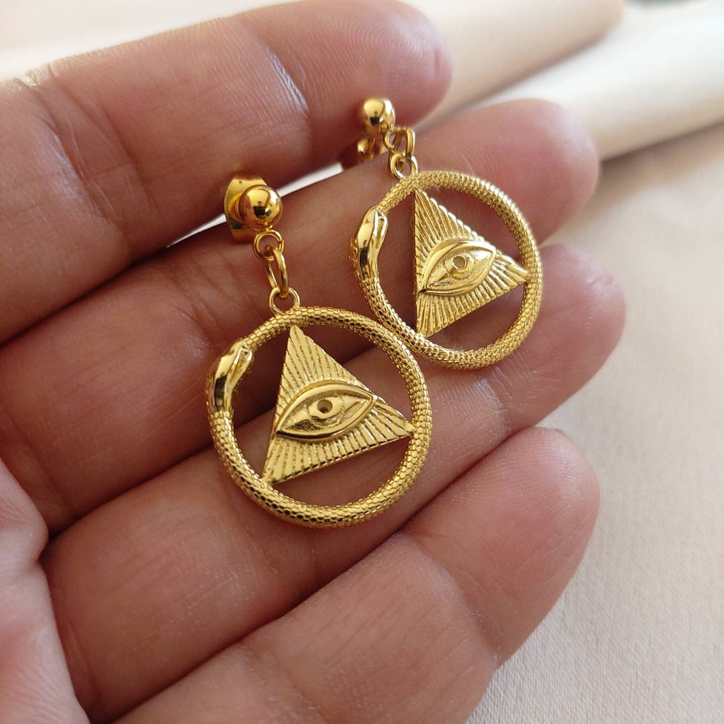 Gold snake earrings , ouroboros gold snake earrings , 3rd eye earrings , all seeing eye earrings , mystical earrings with all seeing eye