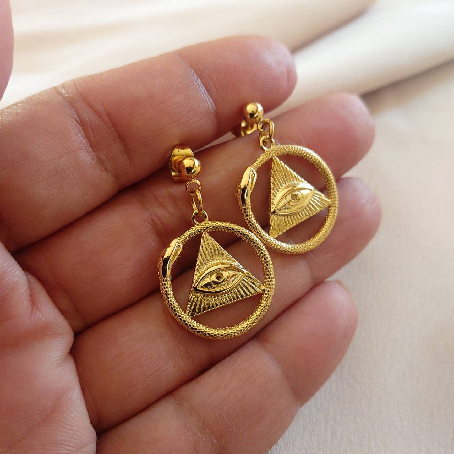 Gold snake earrings , ouroboros gold snake earrings , 3rd eye earrings , all seeing eye earrings , mystical earrings with all seeing eye